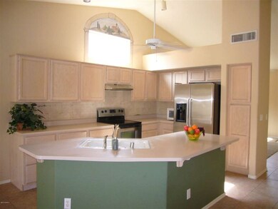 kitchen w/ window above cabinets