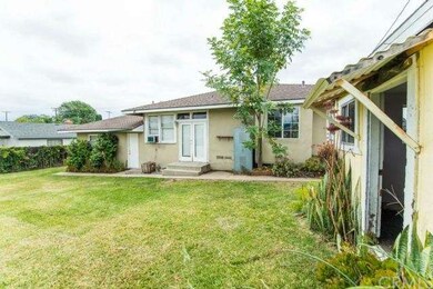The spacious backyard has plenty of grassy play ar