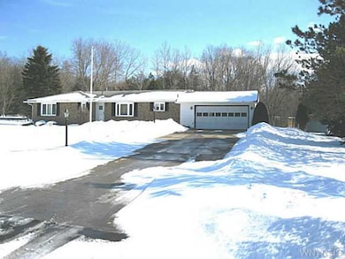 Exterior Front. Large treed lot.