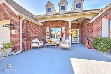 They just re-did this concrete stained pad to have a nice sitting area out front & the driveway too.