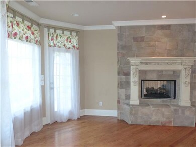 Located just off the kitchen, the Breakfast Room is the perfect place to start your day! It features a double sided fireplace, a door leading to the deck, and windows that let in lots of natural light! 