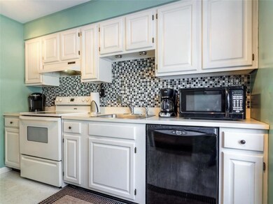 Light-filled kitchen with tiled...