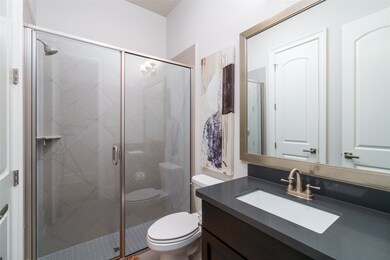 Modern first-floor bathroom featuring a sleek show
