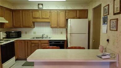 Large eat in kitchen with breakfast bar.
