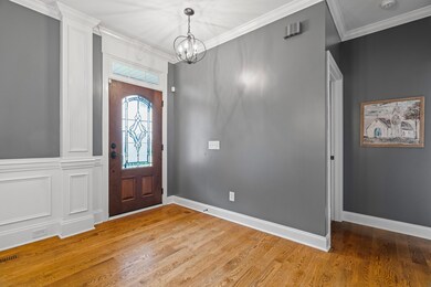 The beautiful front door and updated lighting fixture welcomes you to a wonderful home!