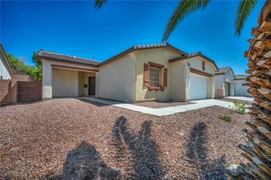 View of front of house with stucco siding and an a