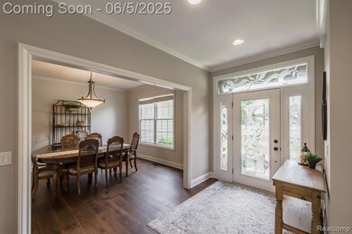 Open joyer with hardwood floors & crown molding