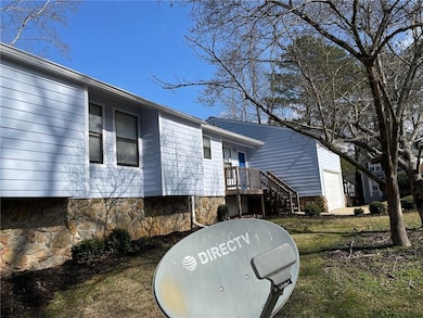View of side of home featuring a garage