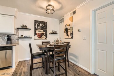 Dining area featuring baseboards, wood finished fl