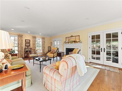 Living  room with fireplace and 2 sets of double d