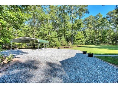 Plenty of parking space and an oversized carport!