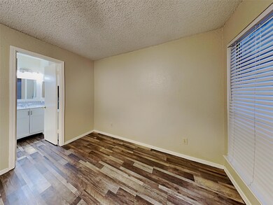 Unfurnished bedroom featuring ensuite bathroom, a 