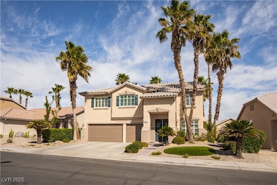 Mediterranean / spanish house with a garage, a til