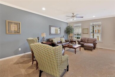 Plush carpeting, recessed lighting and a wide, ope