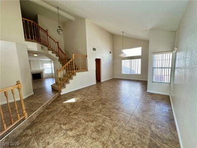 Unfurnished living room featuring high vaulted cei
