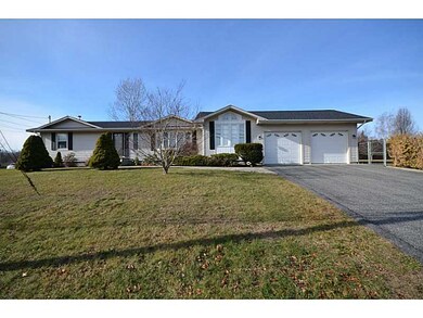 Exterior Front. Garage and driveway