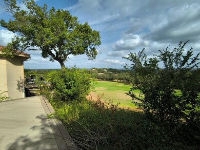 View of grassy yard featuring view of golf course