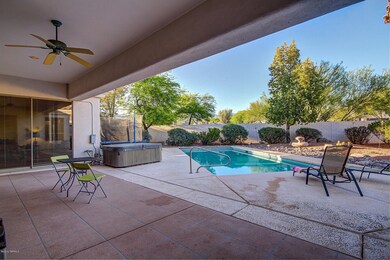 Covered patio overlooking pool & hot tub