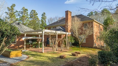 Back View of House showing Pergola with Brick Pati