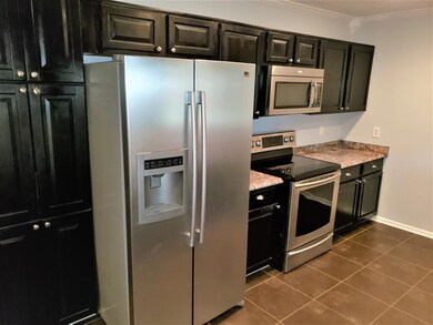 Another view of the kitchen, lots of storage!