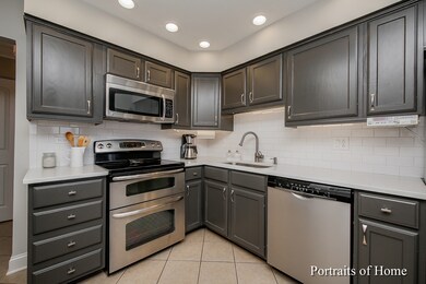 Kitchen with can lights, Quarts counters, and stai