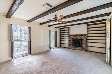 Living room with wood burning fireplace