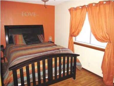 The master bedroom includes a ceiling fan with lig