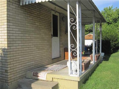Exterior Front. Porch leads to deck