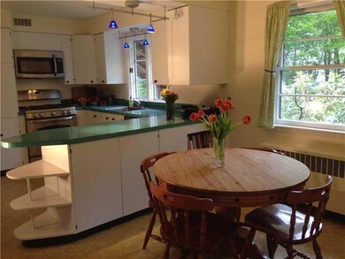 Kitchen. This well-lit kitchen is...