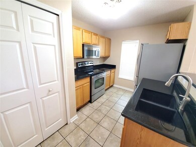 KITCHEN WITH STAINLESS-STEEL APPLIANCES