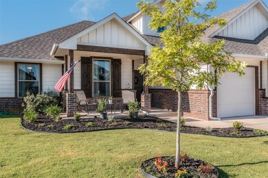 Craftsman house with a front lawn and a garage