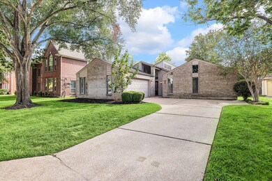 Private driveway leading to a two-car garage. Fron