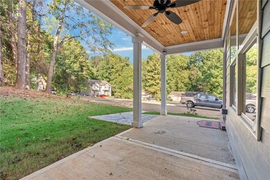 Covered front porch tucked away at the very end of