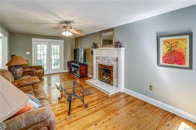 Family Room with Gas Fireplace and French Doors To