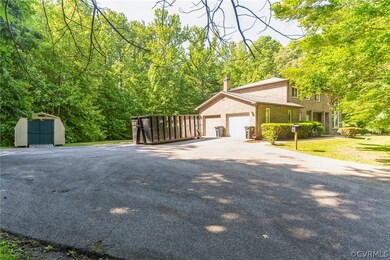 View of front of property with a storage unit and