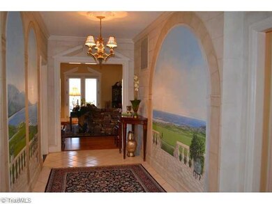 Entry. You are sure to be captivated by the custom paintings of the Pinehurst and Sait Andrews golf courses that lead you to the living room!