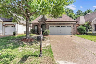 View of front of house featuring brick siding, driveway, a garage, a shingled roof, and a front lawn