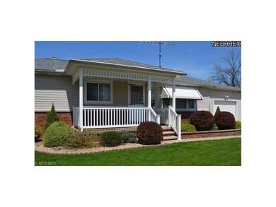 Covered Front Porch View showing manicured landsca