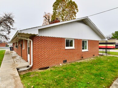 Back side of unit 1 and 2, with back doors entrance and sidewalk