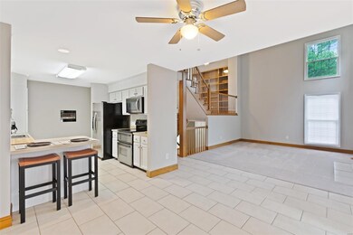 Open breakfast room looking into kitchen and livin