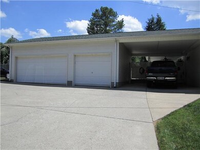 Three car detached garage - and a carport - large concrete drive with extra parking and circle turn around