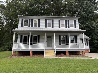 View of front of house featuring covered porch and