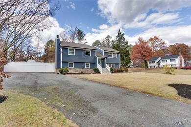 Raised ranch featuring a front yard