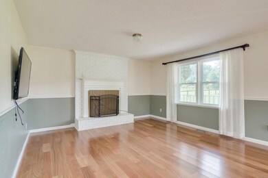 Living Room with Wood Burning Fireplace