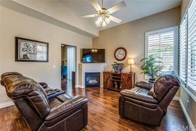 The Living Room with a cozy fireplace with gas log