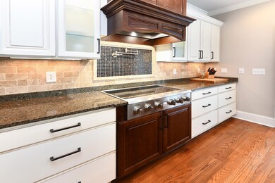 Kitchen featuring stainless steel gas stovetop, cu