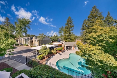 7121 Stella Lane, Unit 24, Carmichael, CA 95608 - Balcony off primary bedroom view of pool & clubhouse