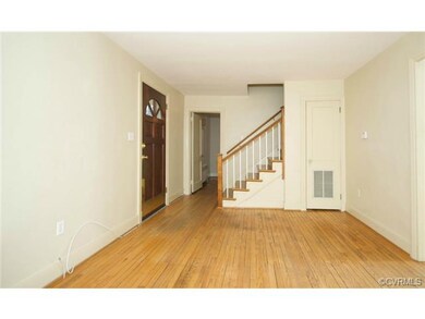 Another view of the living room, showing entry int