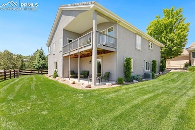 Back of house featuring stucco siding and a patio