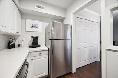Kenmore stainless refrigerator will convey with the condo.  Note the nice 